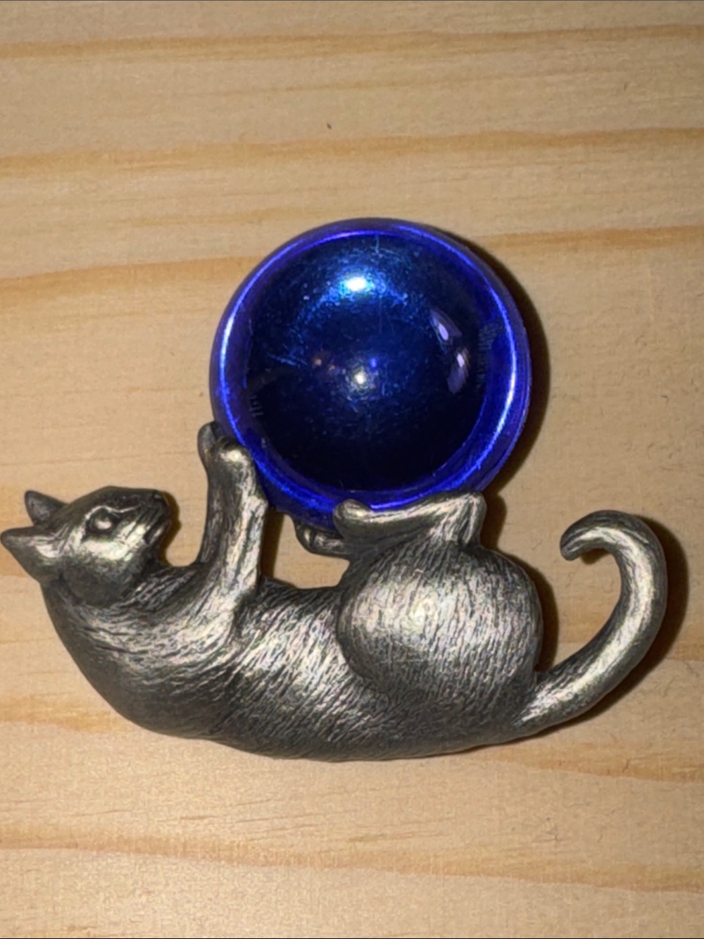 JJ Jonette Vintage pewter cat brooch with a blue glass ball.
